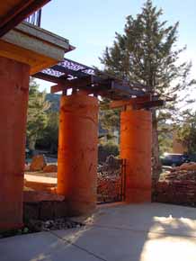 Picture of “green” poured earth columns at entryway